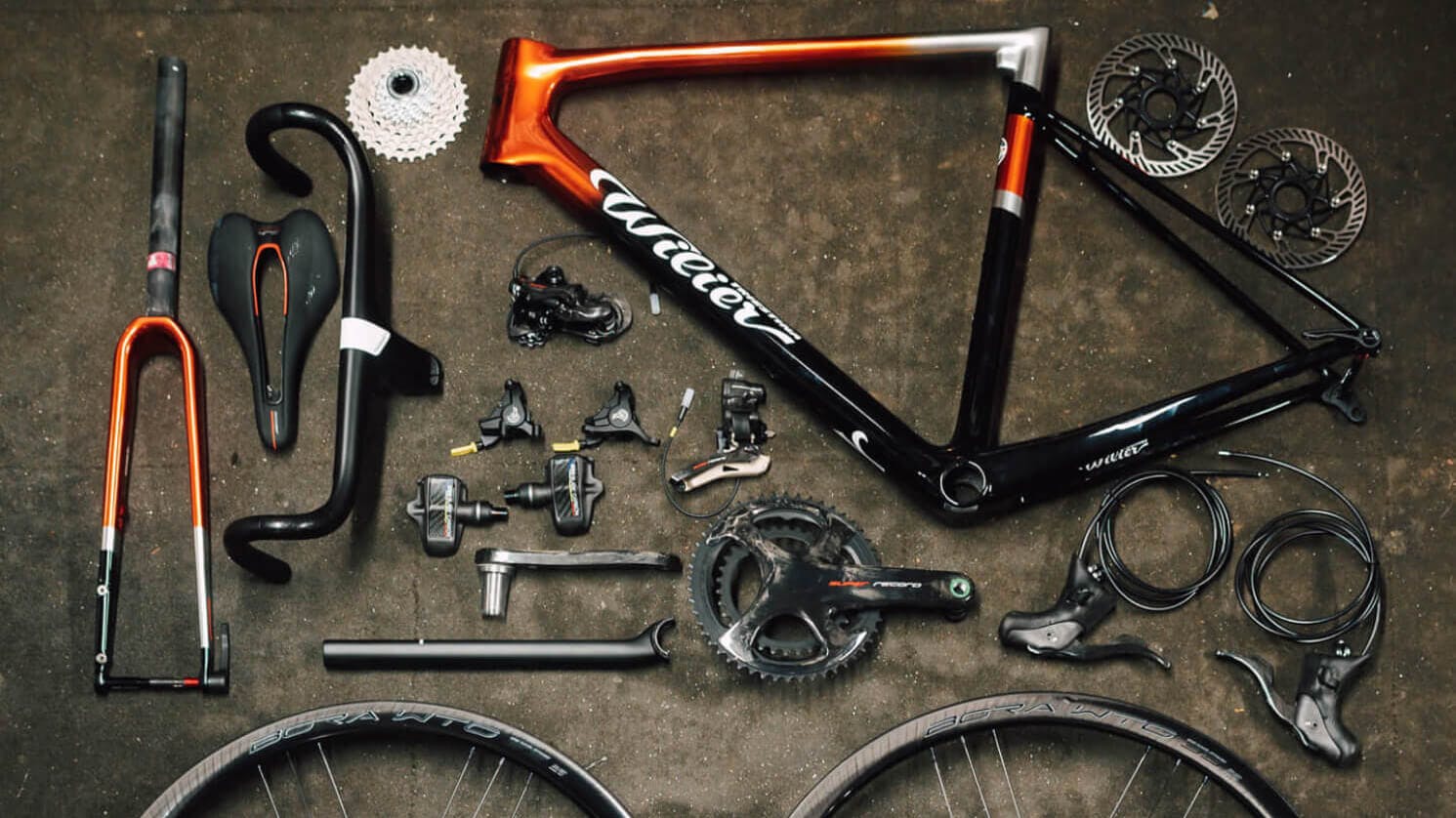 A photo of a dismantled bike with all the components laid out